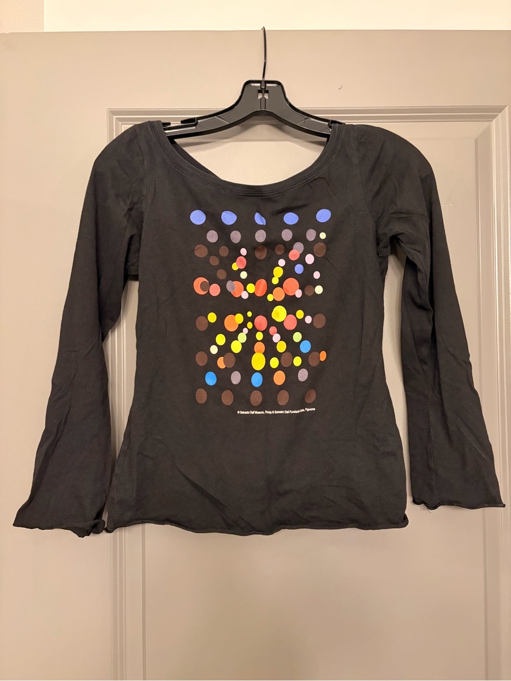 The Dali Museum black slightly flare tee with red/blue/yellow front print.
